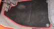 Vloermatten zwart tapijt met rode rand (4 stuks)